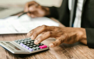 hand and calculator